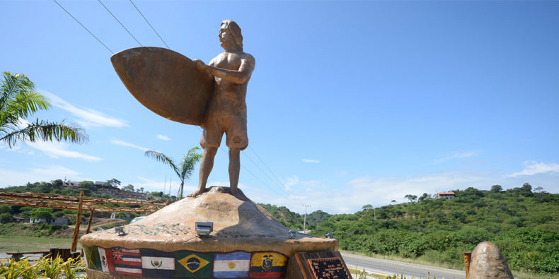 a statue of a surfer in Montañita Ecuador